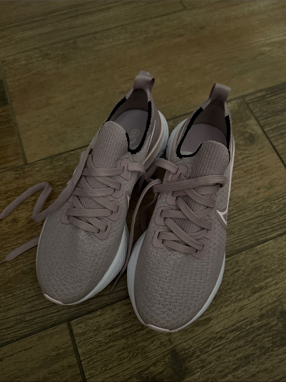 Nike Mauve Flyknit Running Sneakers with White Sole